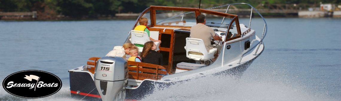 A Small family taking a trip on a white Seaway Boat